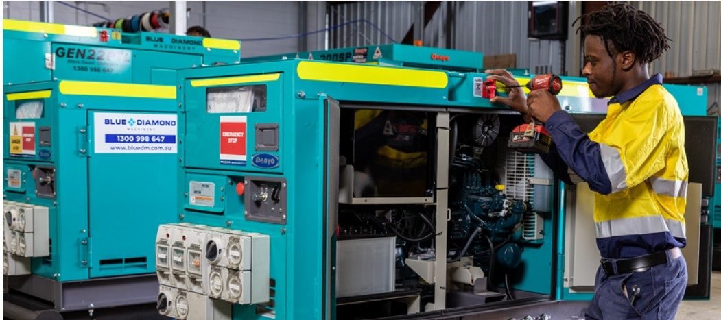 Technician servicing an industrial diesel generator